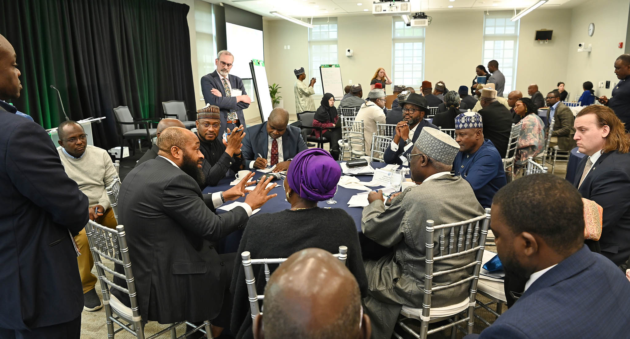 Niger state Governor Mohammed Umar Bago, left foreground, makes a point to fellow governors, officials and experts in a USIP symposium on ways to use U.S. partnership, and peacebuilding approaches, to address Nigeria’s crises and bolster stability.